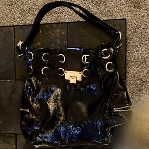 Jimmy Choo black bag with adjustable straps. Leather with zipper pocket on sides